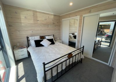 Bedroom with Ranchslider and two wardrobes from a 65sqm home