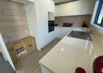 U-shaped kitchen with lots of storage in a 65sqm home